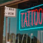 lighted red and green tattoo neon signage