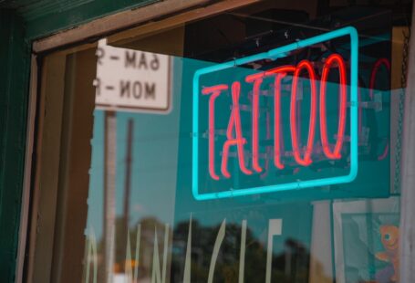 lighted red and green tattoo neon signage