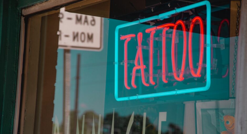 lighted red and green tattoo neon signage