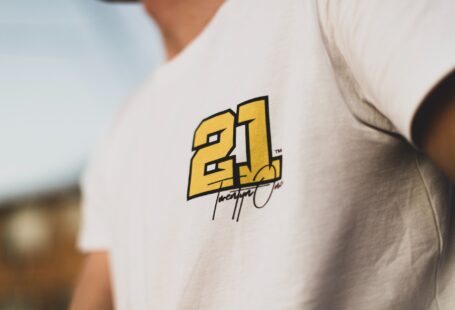 man in white shirt with 21 print
