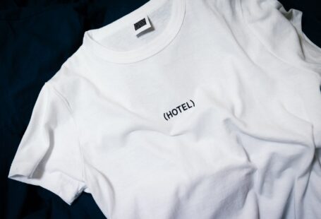 white hotel-printed crew-neck shirt on black surface