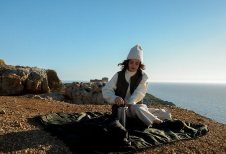 woman sitting on sand