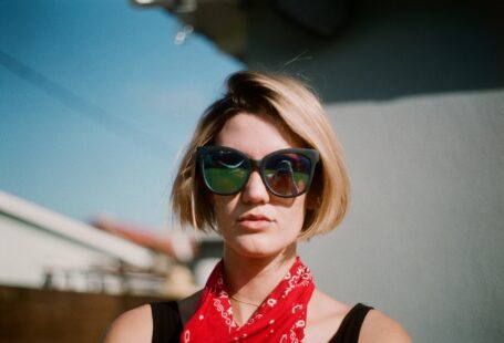 woman wearing sunglasses and scarf